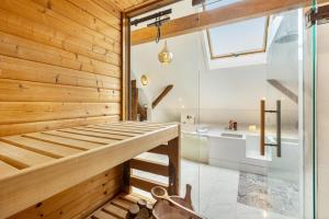 a room with a bunk bed and a bathroom at Ferienwohnung in Anni's Ferienhaus in Großaltenstädten +18 photos