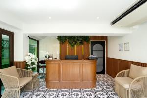 a lobby with a reception desk and chairs at Bangluang Boutique Hotel nearby Wat Arun in Bangkok +89 photos
