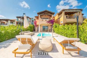 a villa with a swimming pool and a house at Elite Collection Domo Mea Private Pool in Olbia