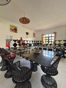 a dining room with a large table and chairs at Skipper Dan Bungalow in La Gaulette +88 photos