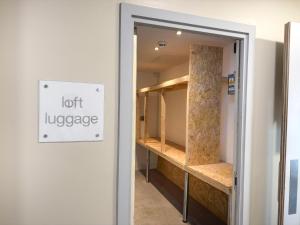 a room with a closet with a sign that reads leftuggage at Citrus Hotel Cheltenham by Compass Hospitality in Cheltenham +76 photos