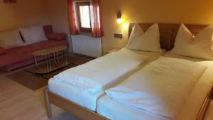 Un pat sau paturi într-o cameră la Riegergut