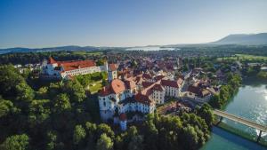 an aerial view of a town on the river at Central City Hotel in Füssen