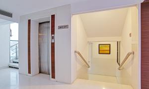 an open hallway with stairs in a building at Treebo Cherry Tree in Indore +33 photos