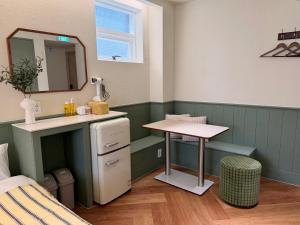 a bathroom with a sink and a mirror at Casa olive 까사올리브 in Millak-tong