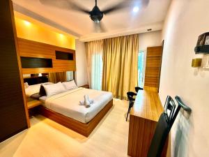 a hotel room with a bed and a desk at Parkview Suites Near By Klcc in Kuala Lumpur