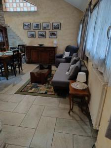 a living room with a couch and a table at Appartamento Luigia House in Cornaredo