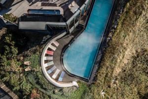 an overhead view of a swimming pool at Hotel Goldener Berg in Lech am Arlberg +154 photos