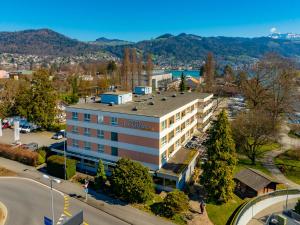 an aerial view of a hotel in a city at Hotel Holiday Thun in Thun