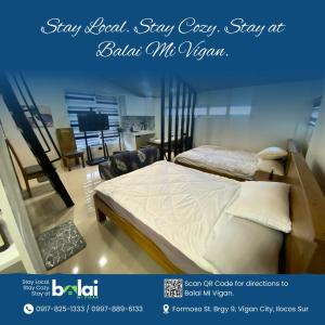 a room with two beds and a tv in it at Balai Mi Vigan in Vigan