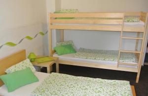 Posteľ alebo postele v izbe v ubytovaní Apartmány Růže