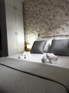 a bedroom with a bed with towels on it at Margarita in Chania