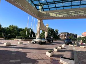 a bridge with cars parked in a parking lot at Красавиците тъмнокоси Sunset Family in Pomorie