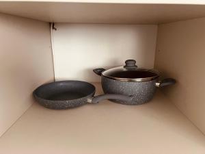 a pot sitting on a shelf in a wall at City View Apartment in Mitrovica +20 photos