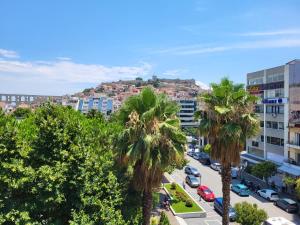 an aerial view of a city with palm trees and buildings at Castle View #3-4 in Kavála