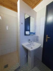 a bathroom with a sink and a mirror at Babis & Popi Rooms and Studios in Frangokastello +70 photos