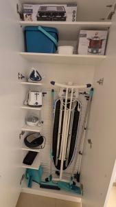 a closet with a rack of kitchen utensils at Villa Müsli in Dettingen an der Iller