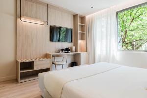 Un pat sau paturi într-o cameră la Hotel Ciencias Select