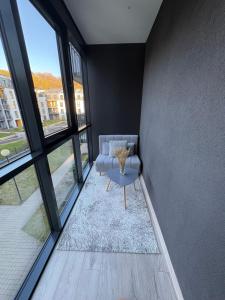 a living room with a couch and a table at Kaunas City Center Apartment in Kaunas
