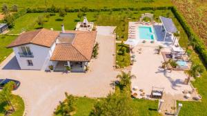 an aerial view of a house with a swimming pool at Villa Kalia Luxury by HDSalento in Aradeo