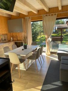 a dining room with a table and chairs at Luma Hause & Spa Karkonosze in Wojcieszyce