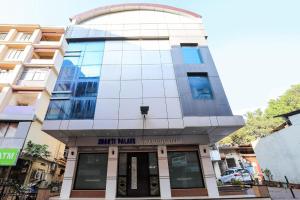 a building with a glass dome on top of it at Hotel Shakti Palace in Ponda