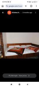 a picture of a bedroom with two beds at zoz mount abu in Jāmb