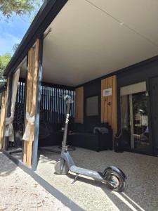 a scooter is parked outside of a house at SUNNY Rest Nest in Pakoštane