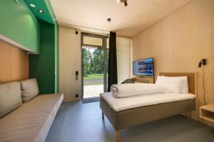a small bedroom with a bed and a window at RS Noatun in Horten +76 photos