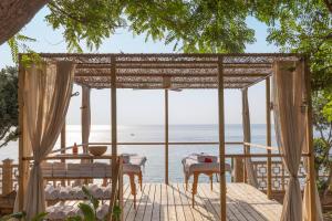 a view of the ocean from the deck of a house at Alua Calas de Mallorca Resort in Calas de Mallorca +63 photos