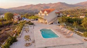 an aerial view of a house with a swimming pool at Villa Brig in Ramljane