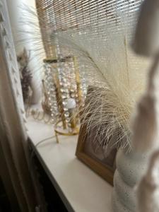 a window sill with a fan and other items on it at Apartament Boho Monte 60 in Sopot