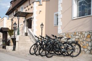 a group of bikes parked outside of a building at Kikelet Club Hotel in Miskolctapolca