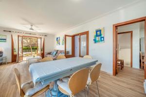 a large room with a table and chairs at Villa Magraner by Sealand Villas in Can Picafort