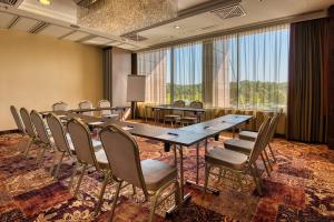 a conference room with a long table and chairs at Aquaworld Resort Budapest in Budapest +153 photos