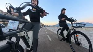 two men riding their bikes on a bridge at Bed and Breakfast Casa Gioconda in Gaeta