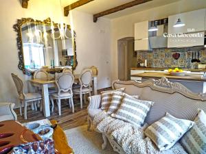 a living room with a couch and a dining room at Bed and Breakfast Casa Gioconda in Gaeta +26 photos