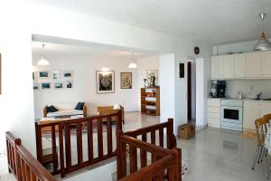 a room with a kitchen and a living room at Villa Bienvenue Apartments in Kanapitsa