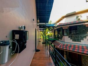 a hallway of a building with a balcony at JFZ Homestay in Kāsarkod