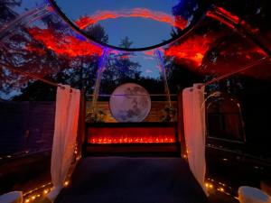 a room with a view of the moon through a window at Bubble-Hotel Deutschland in Orlenbach