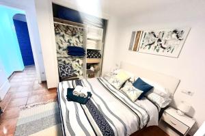 a bedroom with a large bed in a room at Perlazul in Peniscola +55 photos