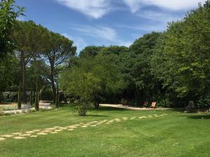 a park with green grass and trees in the background at Domaine Les Martins in Gordes +13 photos