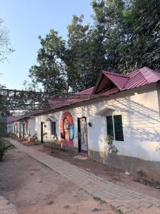a building with a mural on the side of it at Shankars Resort in Guwahati