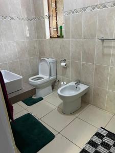 a bathroom with a toilet and a sink at Prime Leisure in Margate