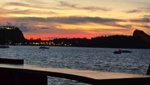 a sunset over a body of water with boats at The Strand Resort Samui in Bangrak Beach +71 photos