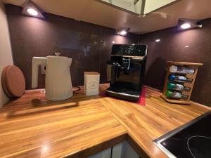 a kitchen with a counter with a coffee maker on it at Feines Alpennest in Hopfgarten im Brixental