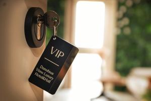 a tag hanging on a door with a key at Danubius View - Luxury Hotel and Hall in Kozloduy +58 photos