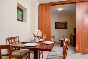 a dining room with a wooden table and chairs at Campsite & Holiday Resort Medveja -by Liburnia Hotels & Villas in Medveja +97 photos