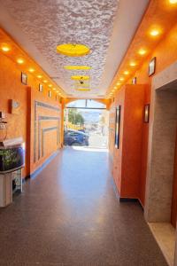 an empty hallway in an office with a yellow ceiling at Nice Apartment with Sea View in Aqaba