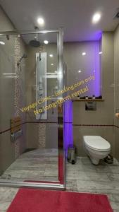 a bathroom with a glass shower and a toilet at VOYAGE CUBIC Adults Only in Sibiu +54 photos